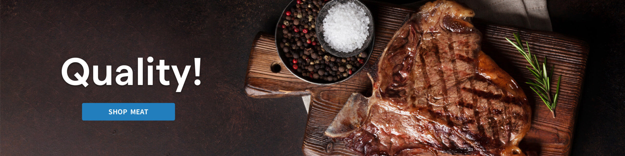 Cooked meat, salt and peppercorns on a wooden cutting board.